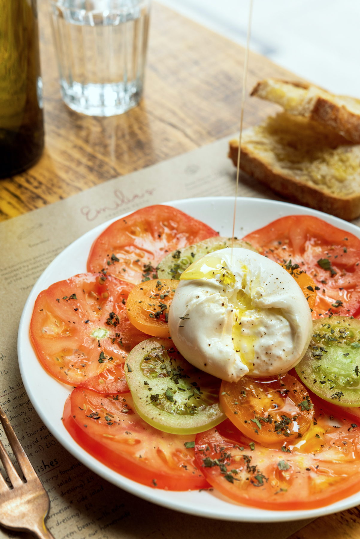 burrata-salad-heritage-heirloom-tomatoes-extra-virgin-organicolive-oil-drizzle-emilias-crafted-pasta-london-restaurant-st-katharine-docks-aldgate